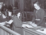 Black and white photo of female librarian circ 1940 - 1950 (147k)