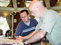 Terry signs an item for a fan